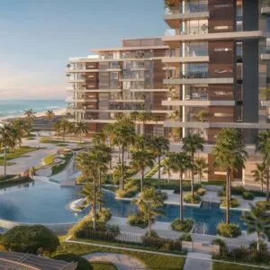 Modern beachfront residential building with landscaped gardens and pool