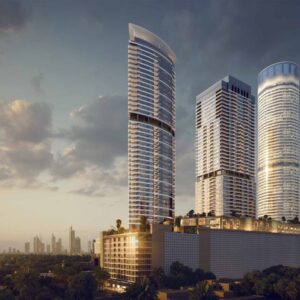 Modern high-rise residential towers with city skyline at sunset