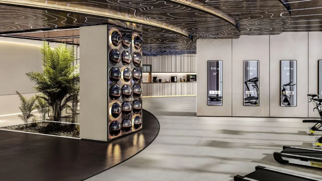 Gym interior with exercise equipment and decorative ceiling at Ciel Vignette Collection Dubai Marina
