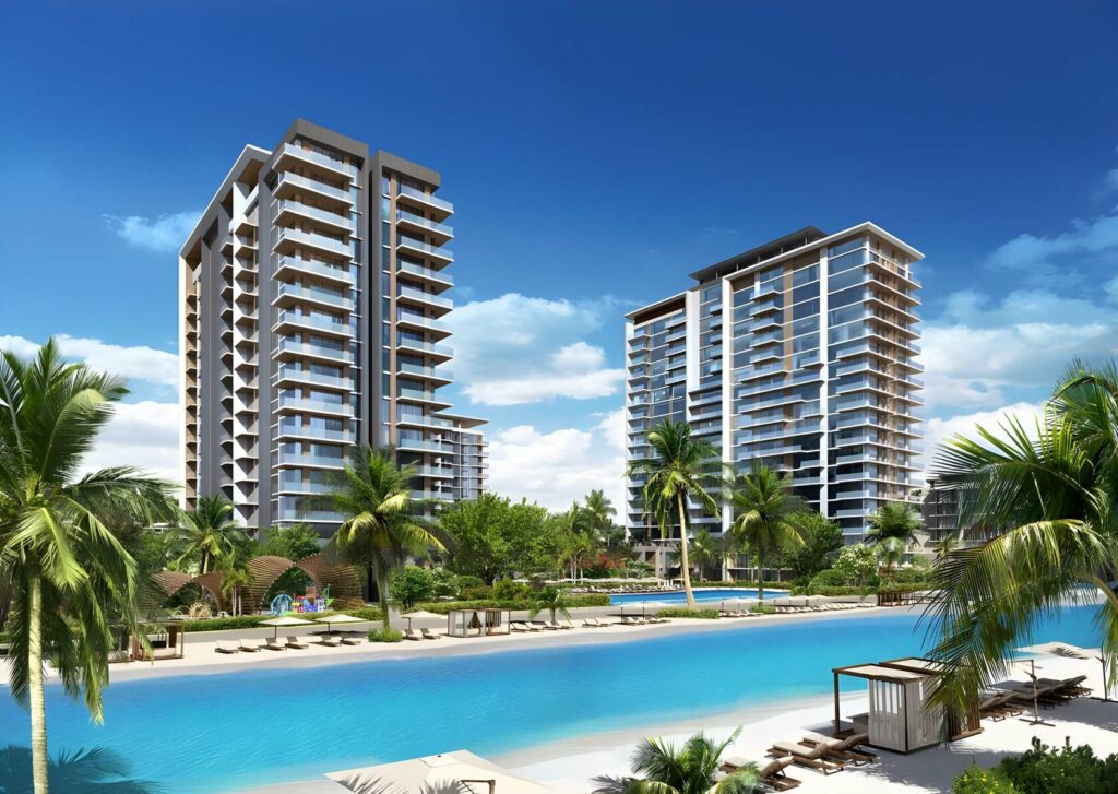Modern residential towers with pool and palm trees under blue sky