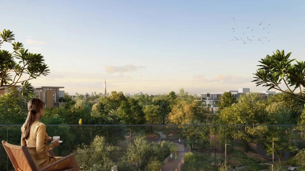 Balcony view overlooking greenery and city skyline at Ghaf Woods DubaiLand Dubai