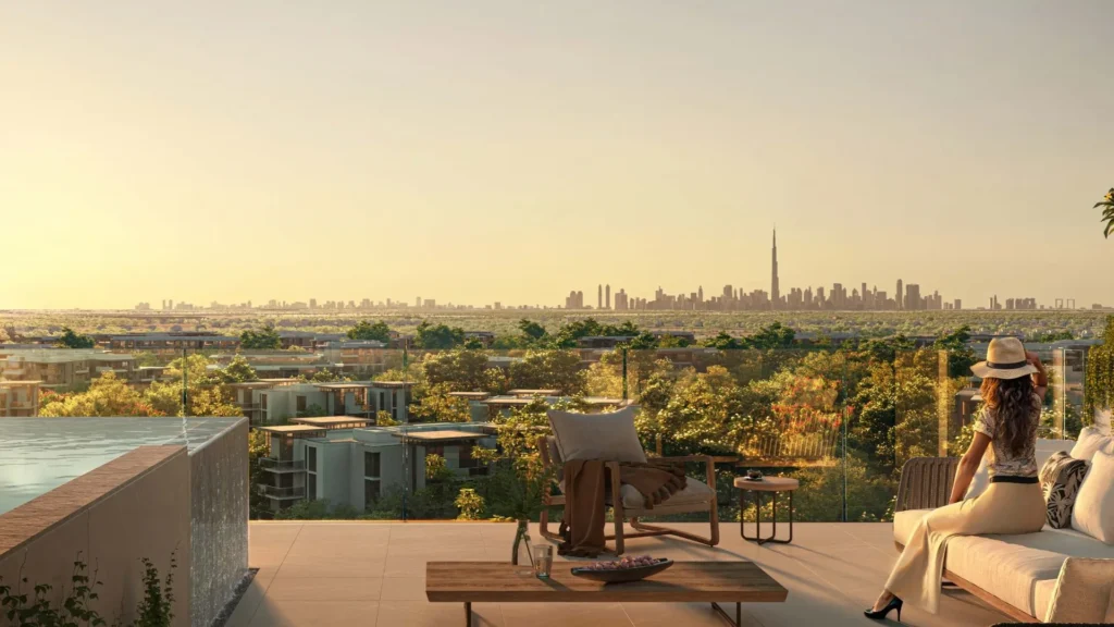 Balcony seating area with city skyline view in Ghaf Woods DubaiLand Dubai apartment