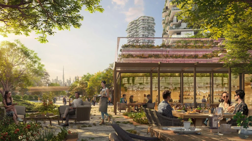 Outdoor seating area and greenery at Ghaf Woods DubaiLand Dubai