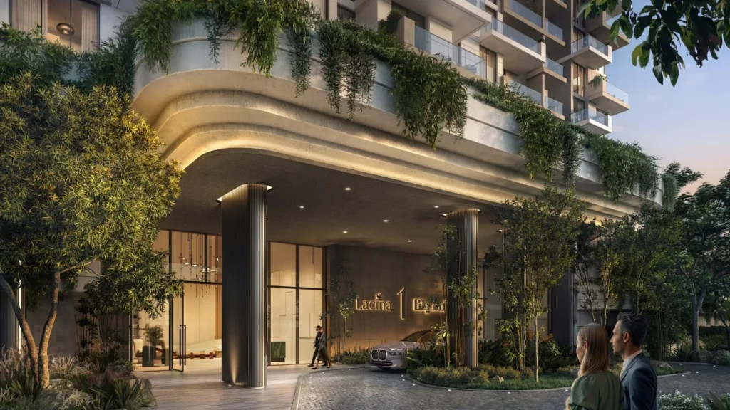 Apartment building entrance with greenery at Ghaf Woods DubaiLand Dubai