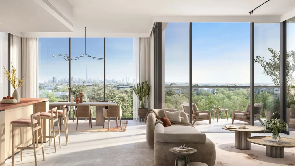 Living room and balcony with city view in Ghaf Woods apartment DubaiLand Dubai