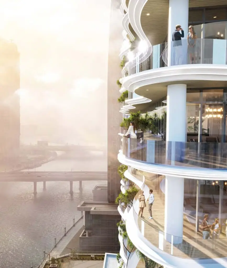 Balconies with glass railings overlooking water at Chic Tower Business Bay Dubai