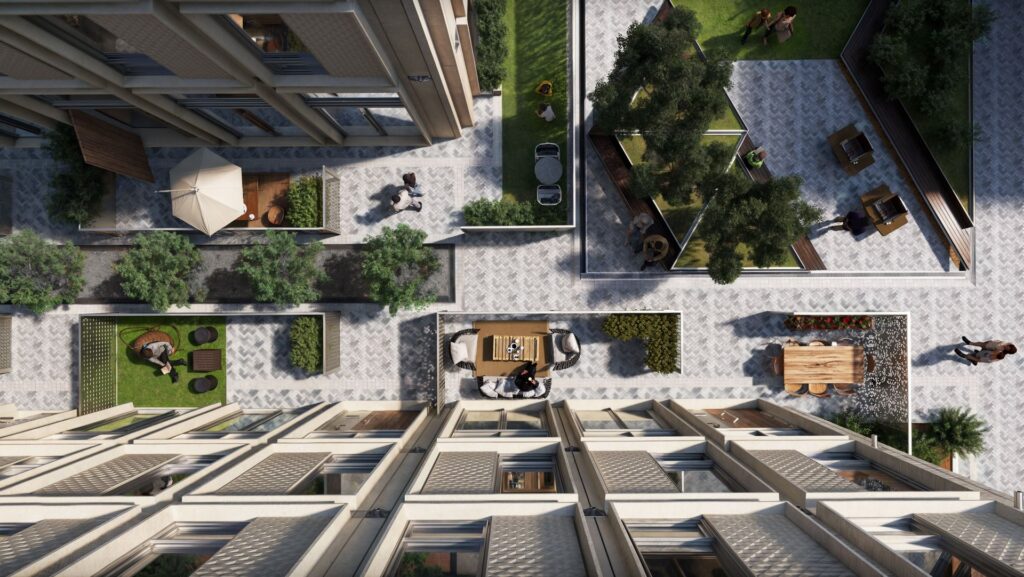 Top-down view of building exterior with outdoor seating and greenery