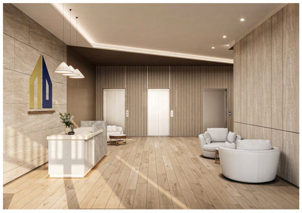 Lobby area with reception desk and three elevators