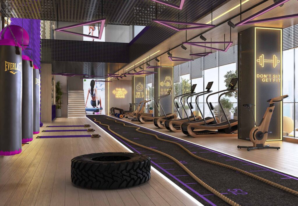 Indoor gym with treadmills, punching bags, and exercise equipment