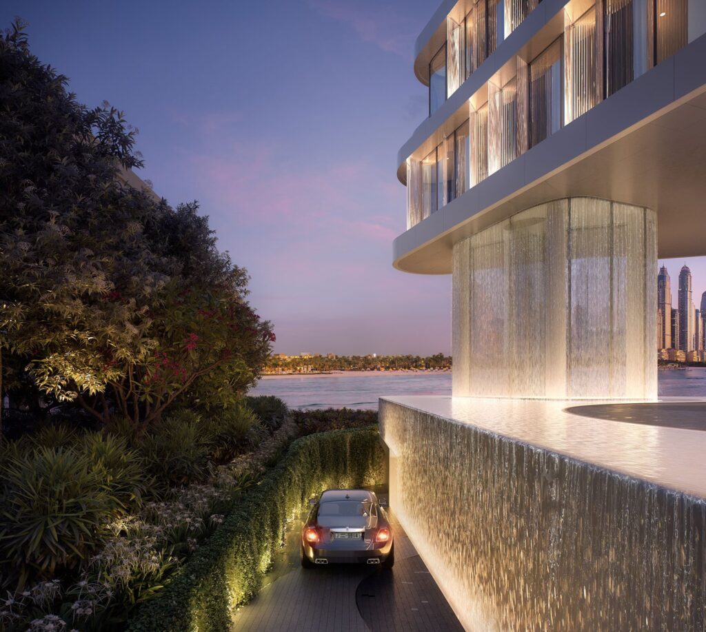 Exterior view of building with waterfall feature and car driveway
