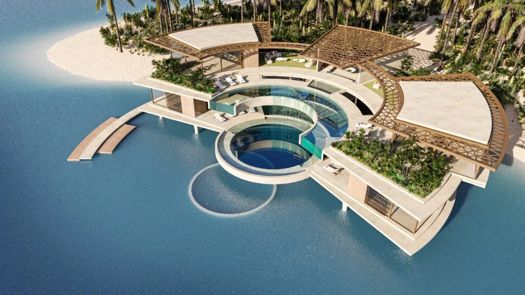 Aerial view of a circular clubhouse with pool on water