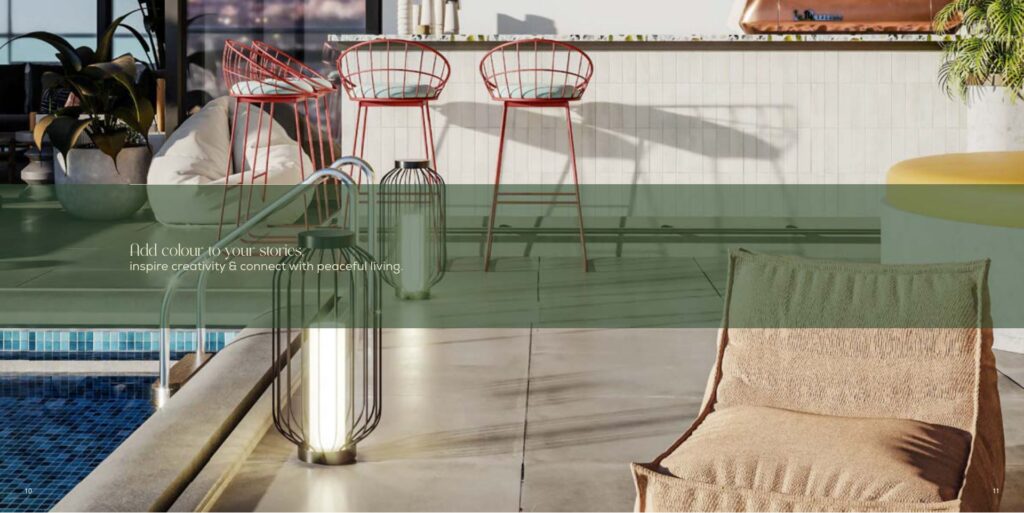 Outdoor poolside seating area with bar stools and lounge chair