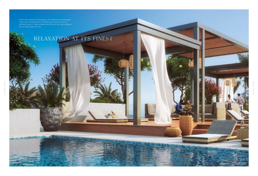 Outdoor poolside cabanas with lounge chairs and trees