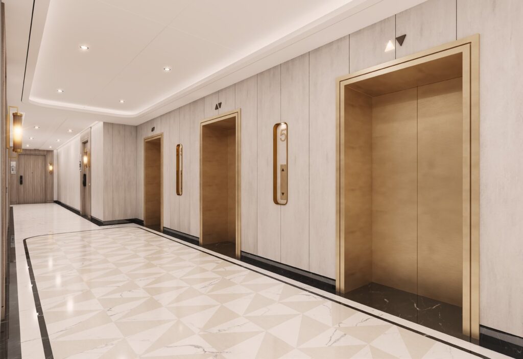 Interior corridor with three elevator doors and tiled floor