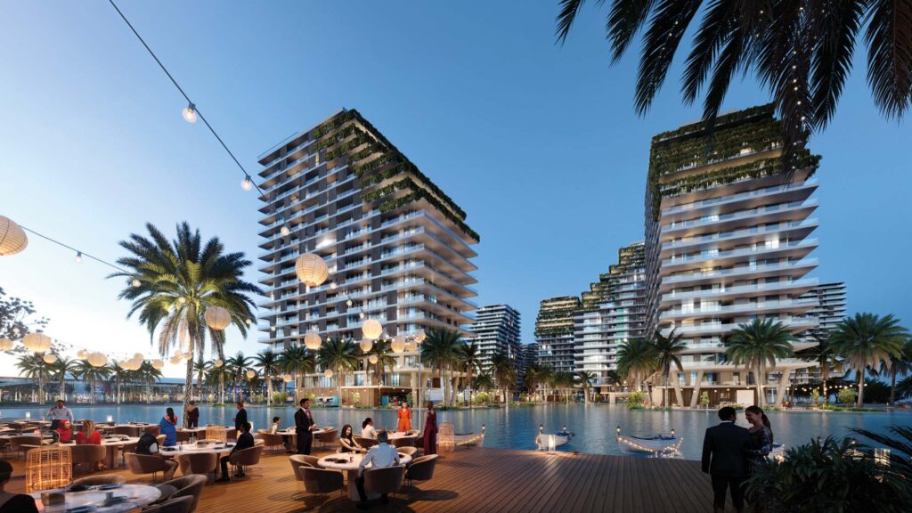 Azizi Venice 6 — Ресторанная терраса у воды и корпусов