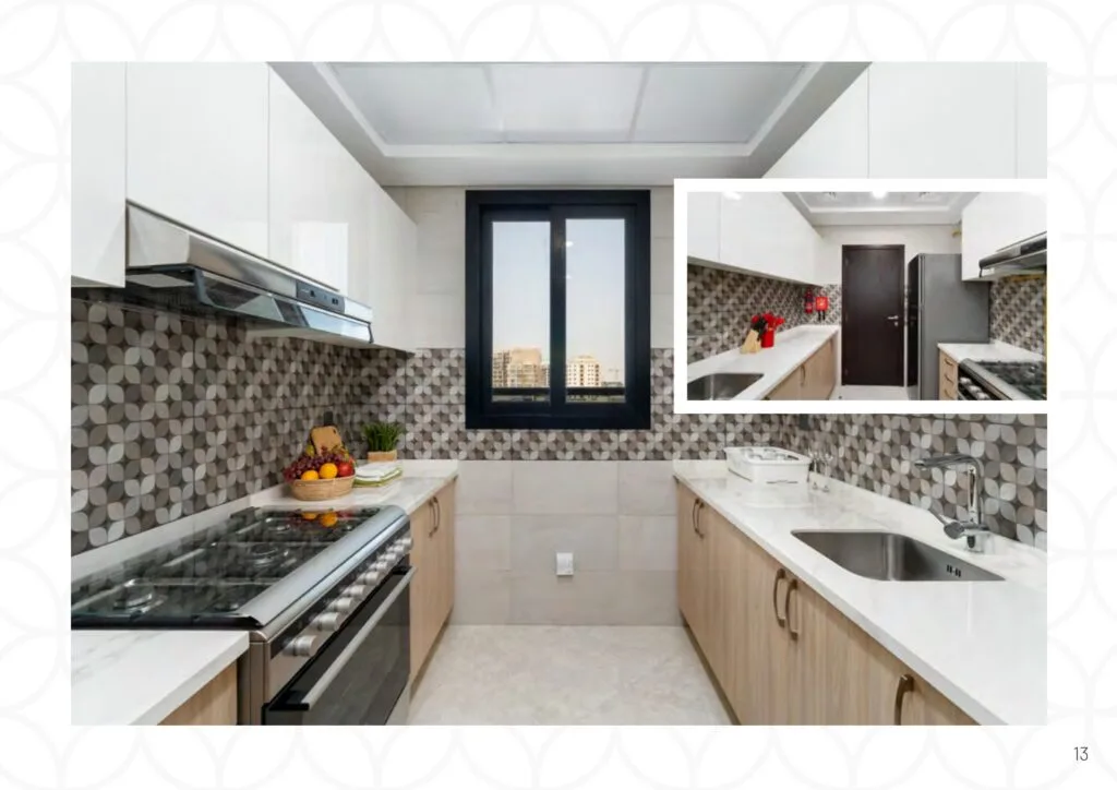 Modern kitchen with stove, sink, and patterned backsplash
