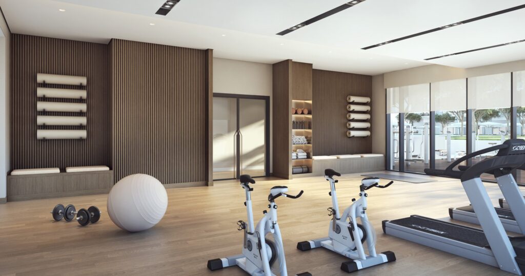 Interior gym room with exercise bikes, treadmill, and fitness equipment