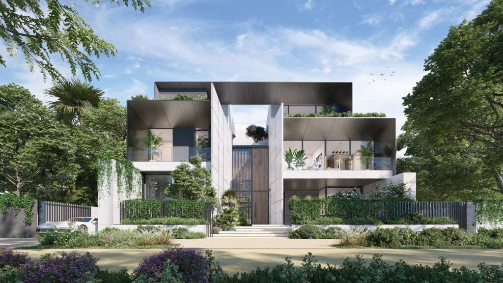 Modern multi-level residential building with greenery and clear sky