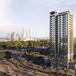 Exterior view of Boutique 23 residential tower in Al Jaddaf Dubai with city skyline background