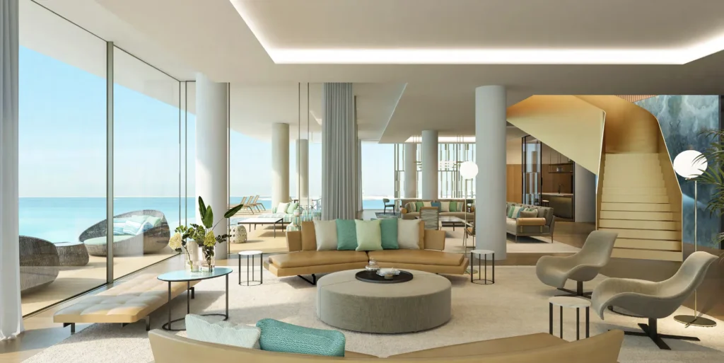 Double-height mansion living room with floor-to-ceiling glazing, sea view and sculptural staircase (developer rendering)