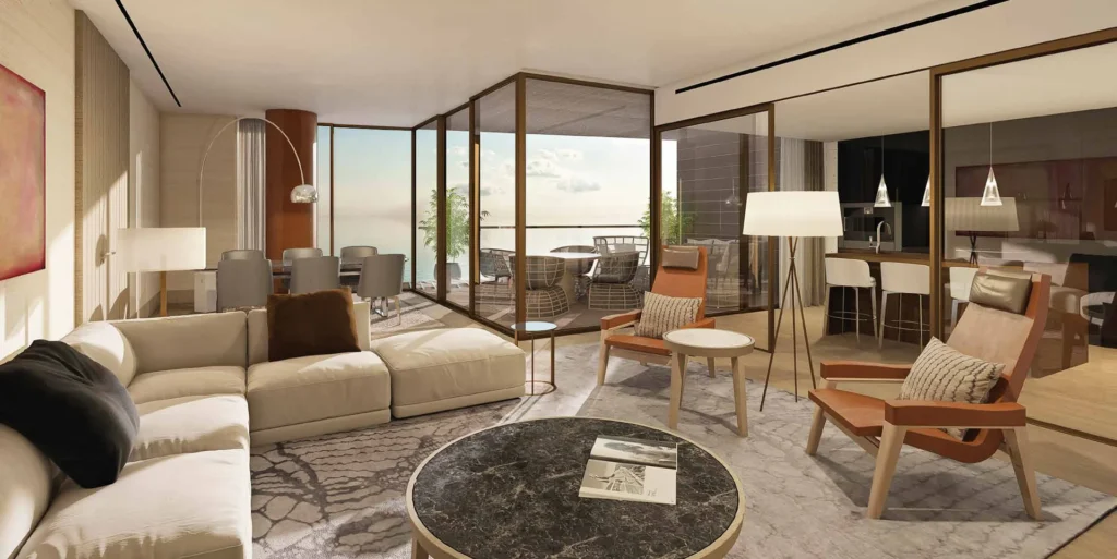 Apartment living and dining room with sea-facing glazed terrace (developer rendering)