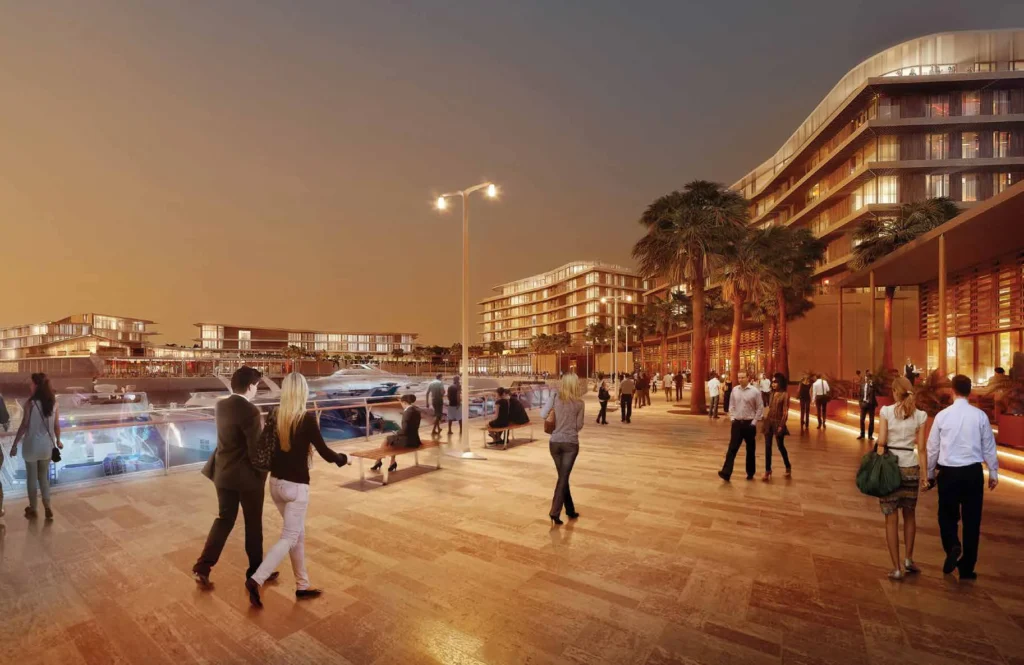 Evening promenade with pedestrians beside Bulgari Resort and Residences (developer rendering)