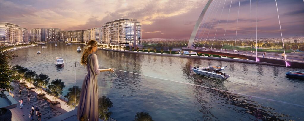 View of waterfront buildings and bridge with boats on water