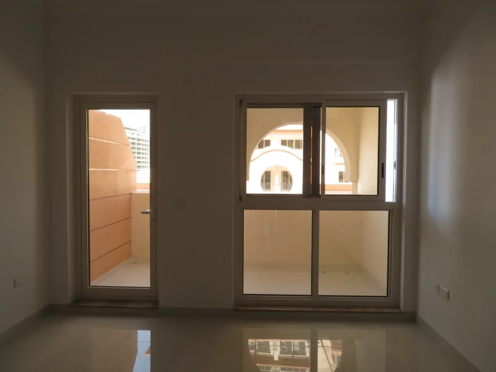 apartment room with balcony door, Canal Residence West 2, Dubai Sports City, Dubai