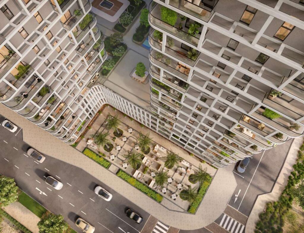 aerial view of two modern residential towers with outdoor seating area