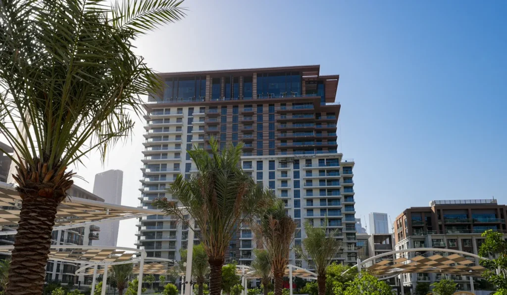 Central Park at City Walk by Meraas in City Walk, Dubai — Modern residential building framed by landscaped palm-lined walkways