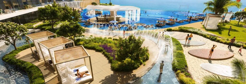 Outdoor pool area with water features and shaded seating