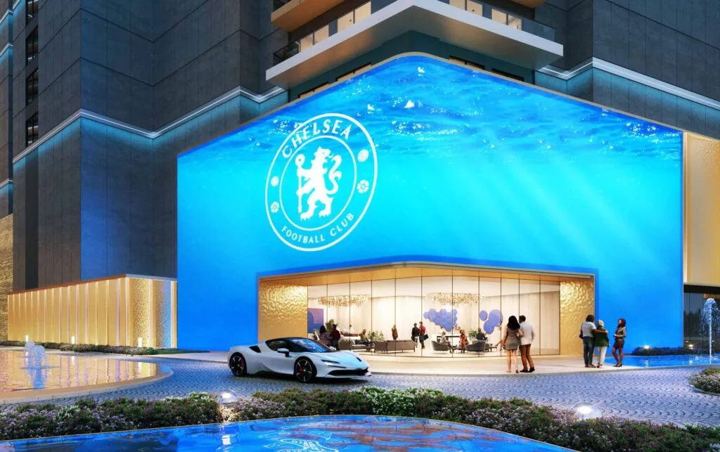 Exterior view of building with blue lion statue and illuminated logo