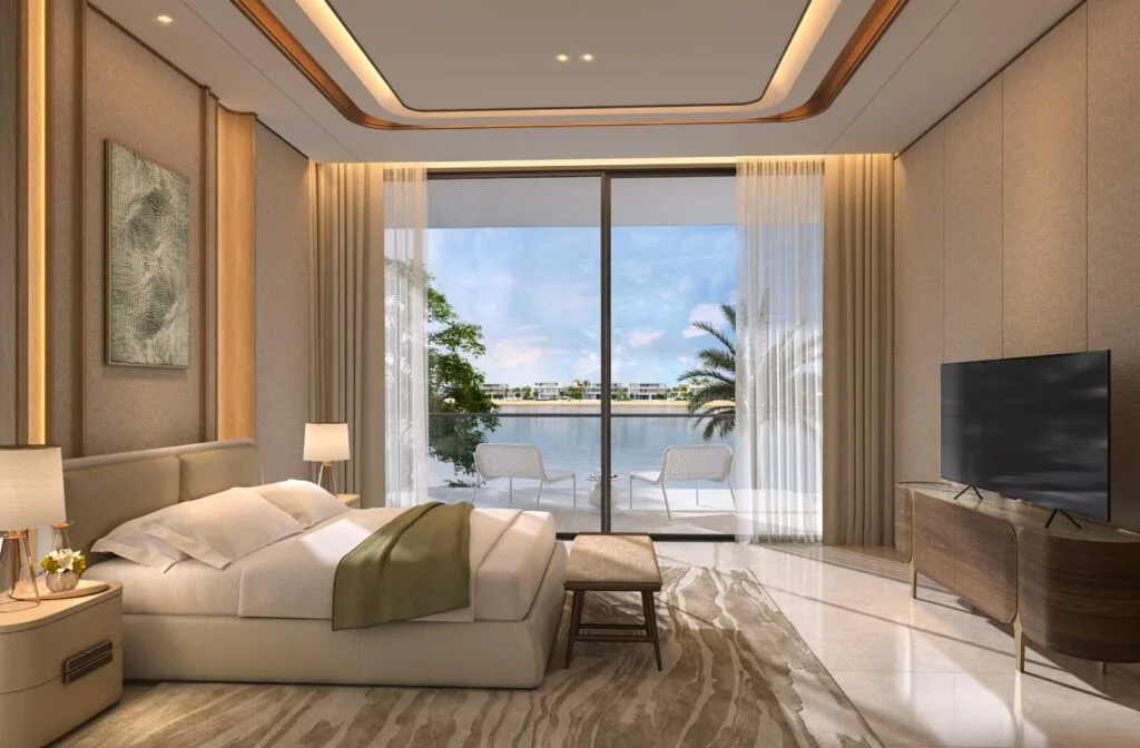 Bedroom interior with large window overlooking water and palm trees