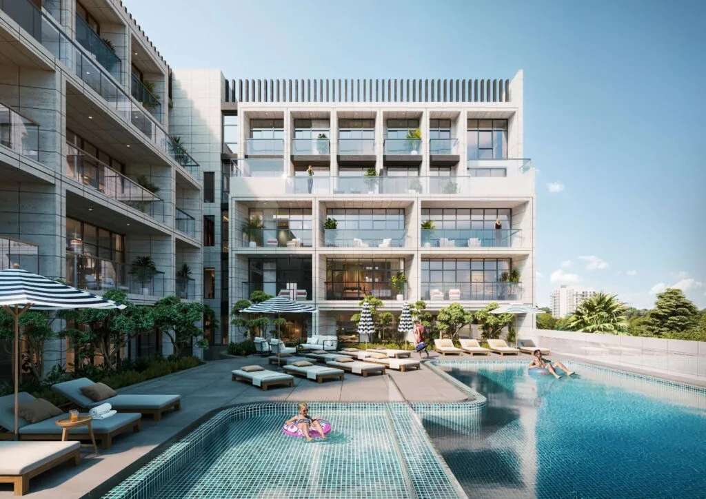 Exterior view of residential building with pool and sun loungers