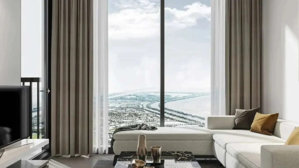 Sobha Orbis Tower A — Светлая гостиная с панорамным видом и мебелью.