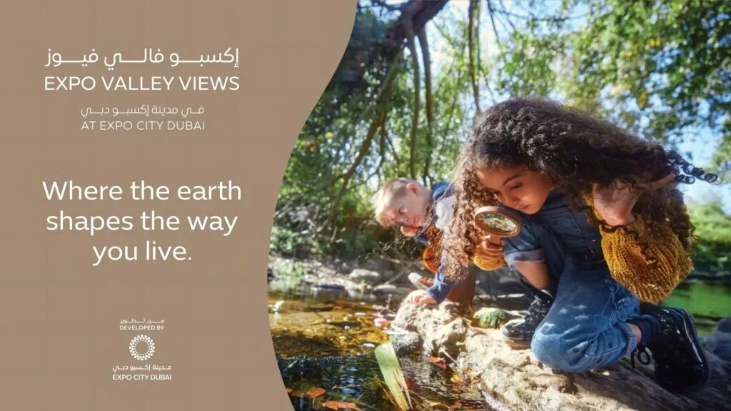 Children exploring a natural water stream outdoors