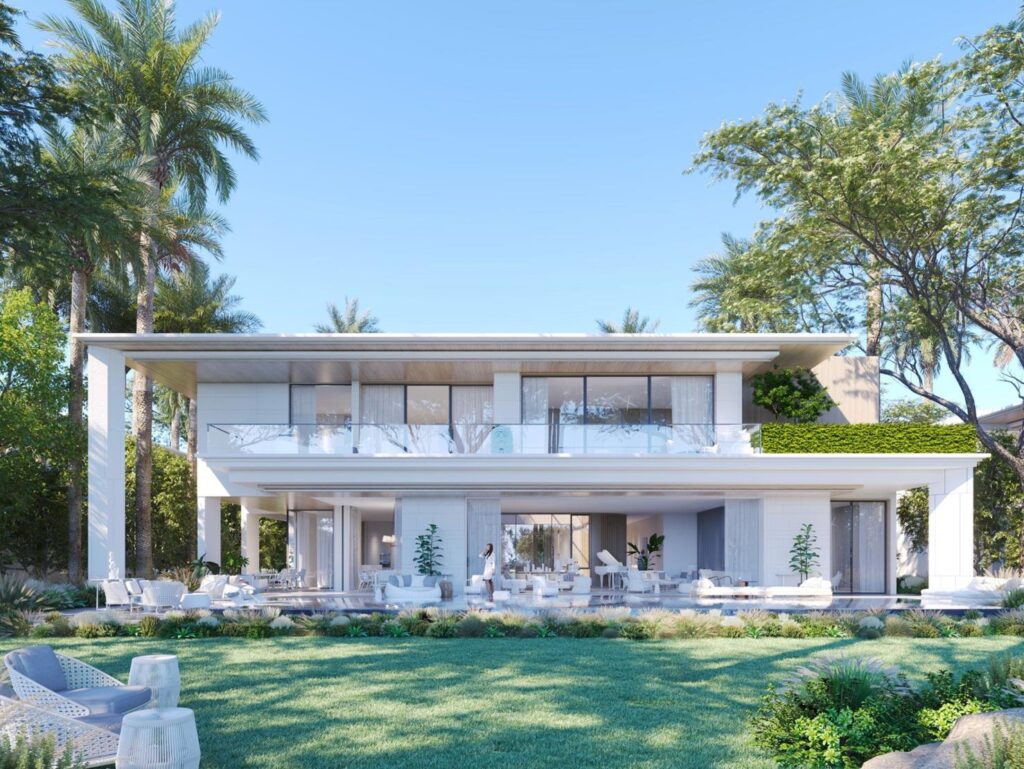 Modern two-story house with large glass windows and garden