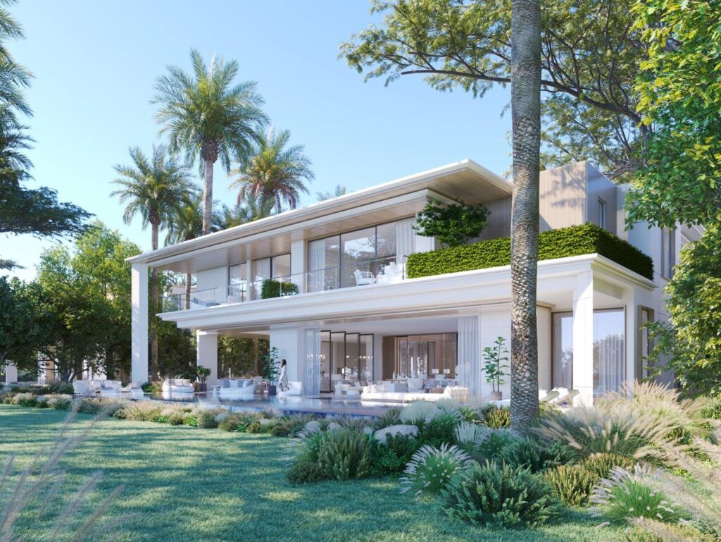 Modern two-story house with large glass windows and garden