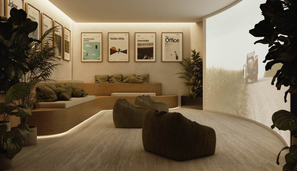Interior cinema lounge with seating, bean bags, and wall posters