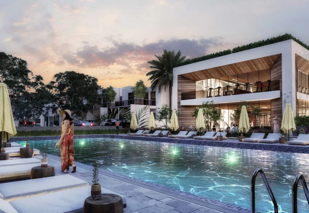 Outdoor pool with sun loungers and modern building