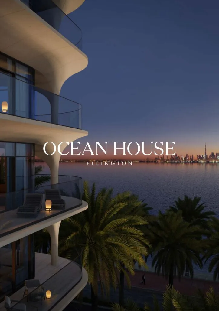 Curved balcony of waterfront building at dusk with city skyline