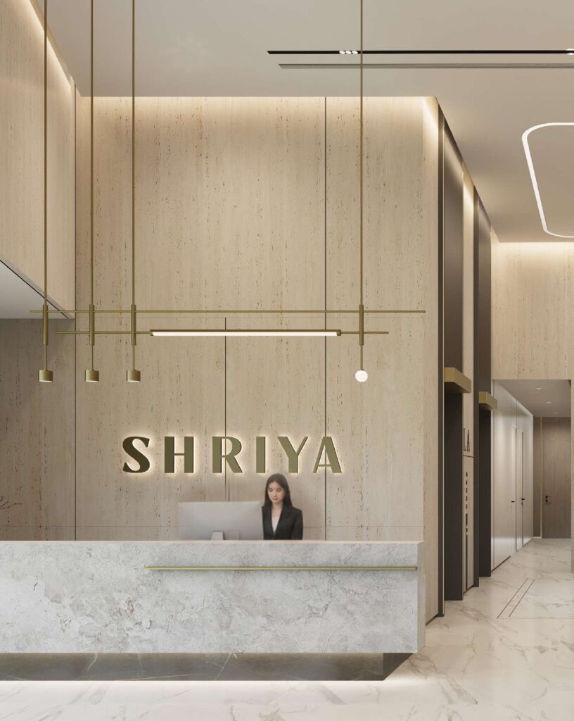 Reception area with marble desk and wall signage