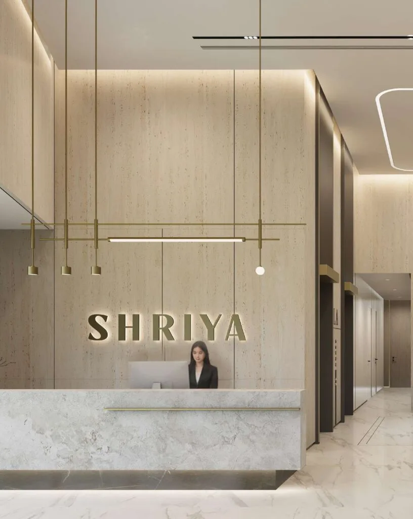 Reception area with marble desk and wall signage