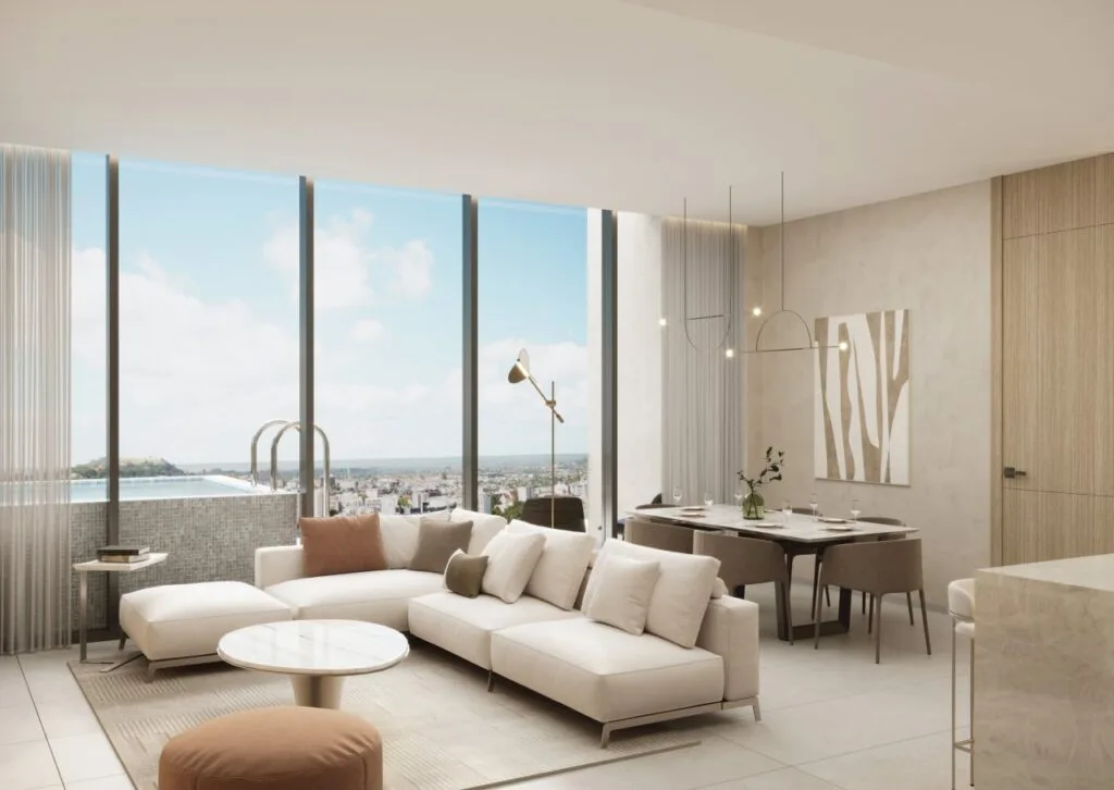 Interior view of a living room with sofa and large windows