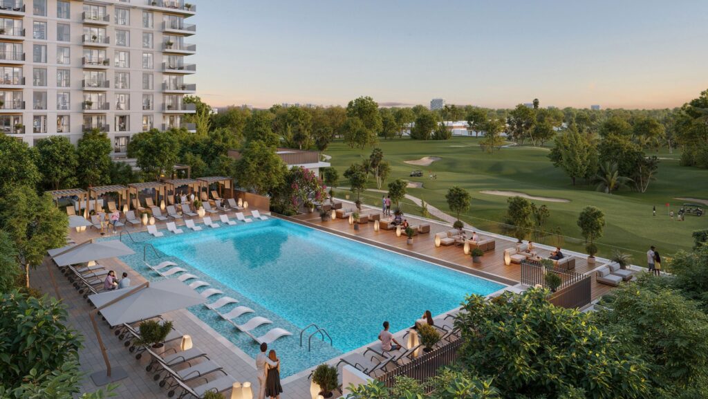 Outdoor pool area with lounge chairs and golf course view