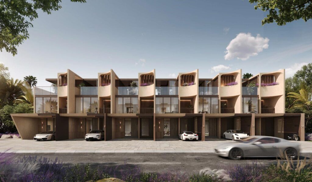 Front view of modern four-bedroom townhouses with cars parked