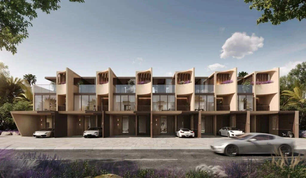 Front view of modern four-bedroom townhouses with cars parked