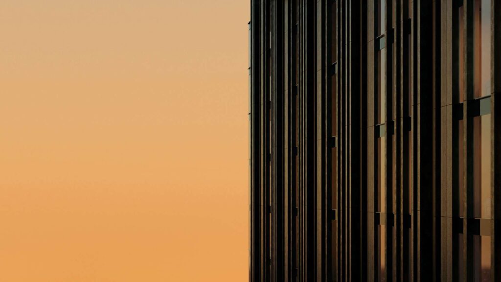 Close-up of modern building facade at sunset