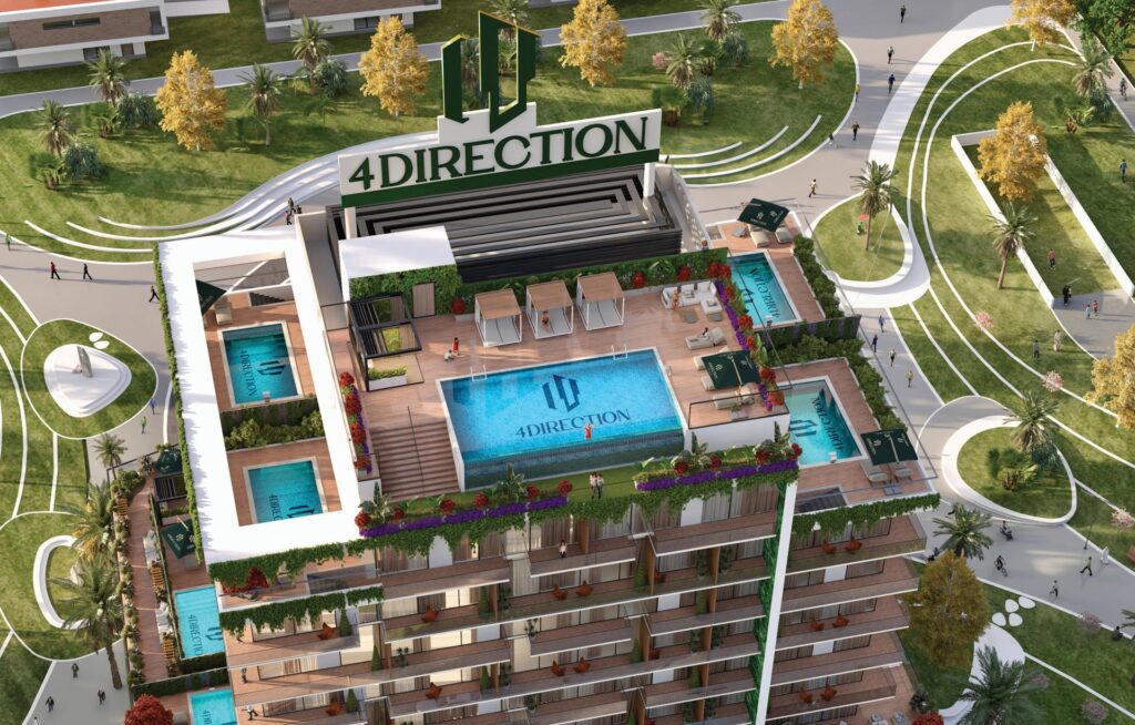 Aerial view of building rooftop with multiple swimming pools and greenery