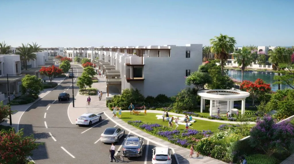 Residential community with road, cars, garden, and pavilion